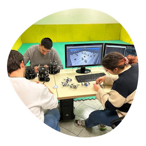 Group of students designing components in computer classroom